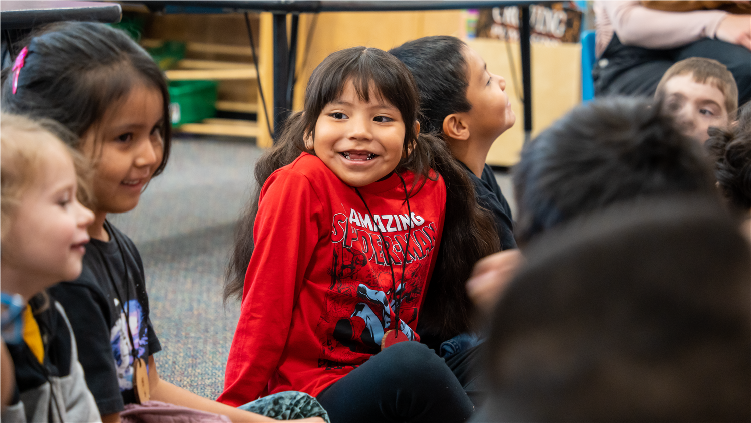 Student smiles at classmates Student smiles at classmates